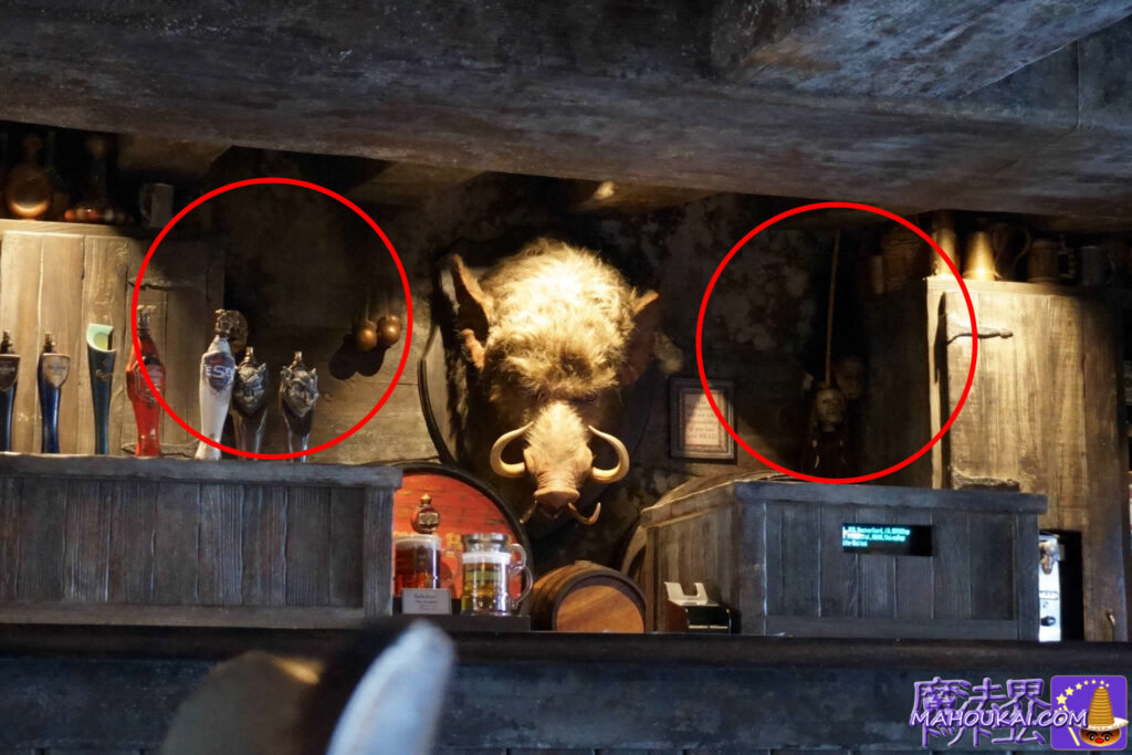 Dried head (Schranken head) USJ 'Harry Potter area' Hog's Head pub Boar's head behind counter and Butterbeer keg
