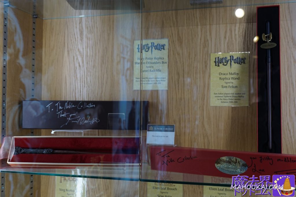 Harry Potter wand: signed Daniel Radcliffe, Draco Malfoy wand: signed Tom Felton The Noble Collection Covent Garden Shop, Harry Potter replica merchandise, London.