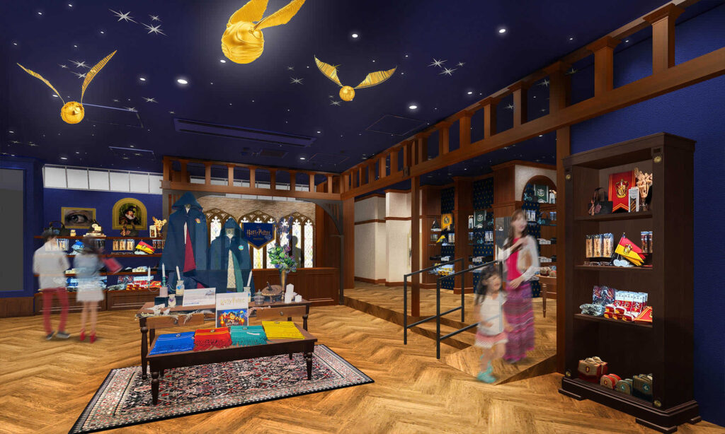 An oversized Harry Potter wand hangs from the ceiling, creating a world of light across the ceiling and patronas decorations across the picture frames throughout the café.