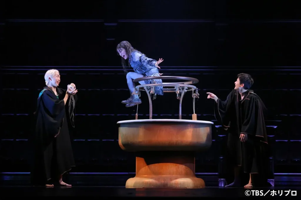Rio Saito as Corpius Malfoy, Karen Miyama as Myrtle of Sorrows and Kohei Fukuyama as Albus Potter in the stage production of HARIPOTA.