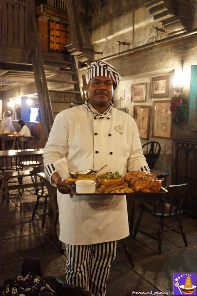 A chef serving the Three Broomsticks' winter special Christmas feast (USJ 'Harry Potter Area').